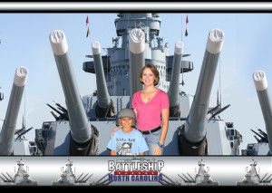 Souvenir photo of a woman and child in front of the battleship