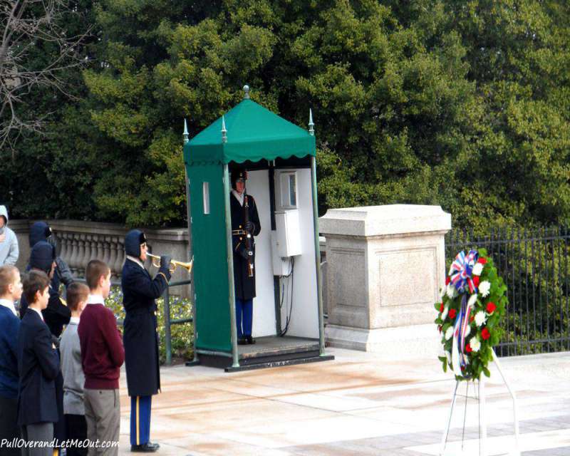 A soldier blowing taps at the Tomb of the Unknown Soldier