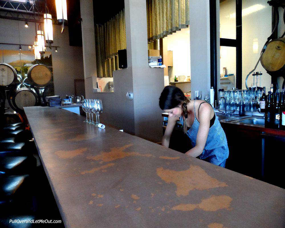 bar tender working behind a bar