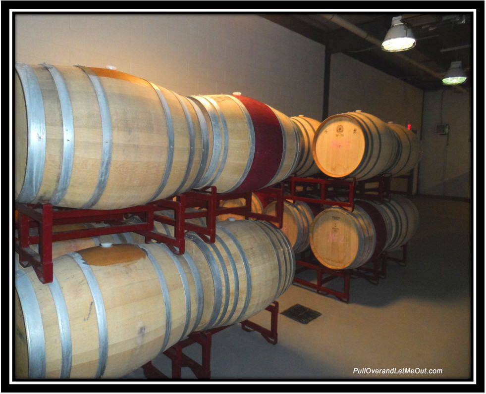 oak wine barrels in the barrel room at Early Mountain Vineyards