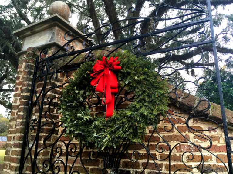 a big wreath on a gate at Boone Hall Plantation