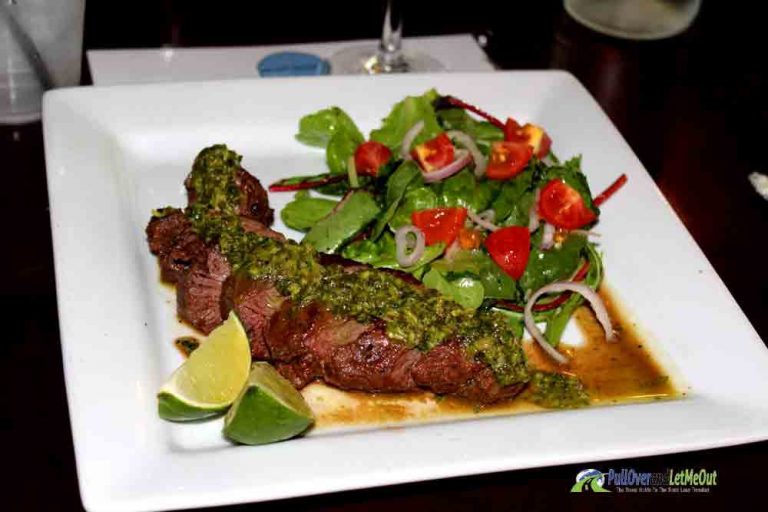 Gourmet dinner of beef and vegetable on a white square plate