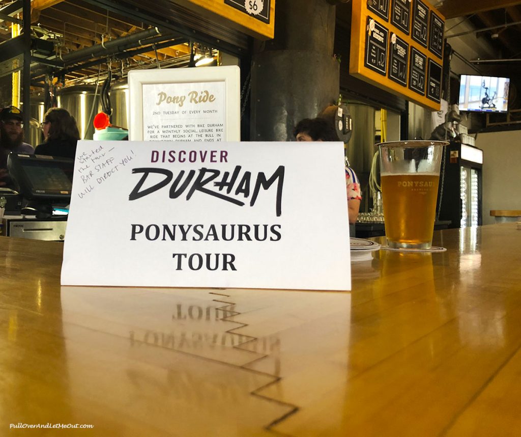 Ponysaurus Tour sign on the bar at Ponysaurus Brewing Durham, NC PullOverAndLetMeOut.com