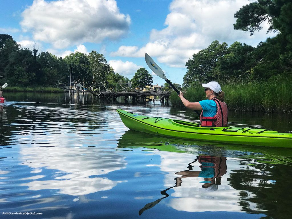 Woman in green kayak.