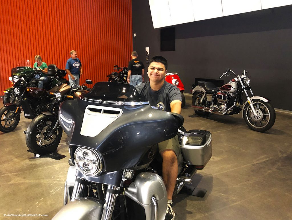 Guy sitting on a Harley-Davidson. PullOverAndLetMeOut