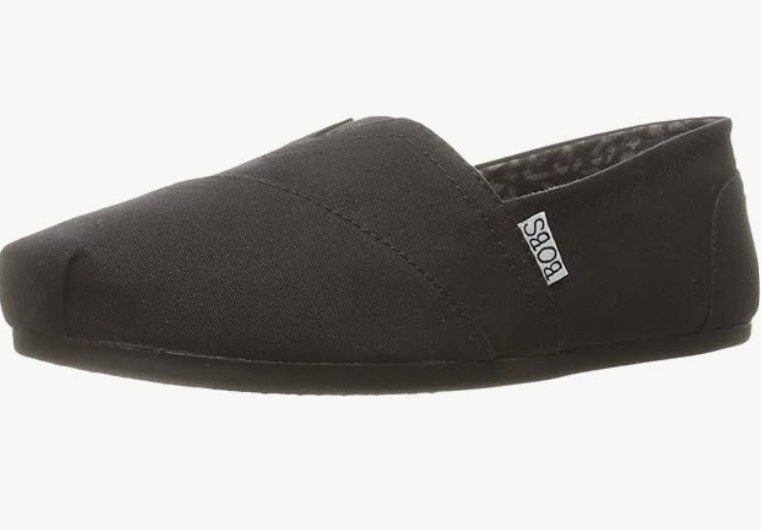 A black flat sneaker