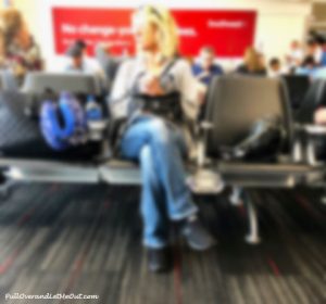 woman in airport waiting area.