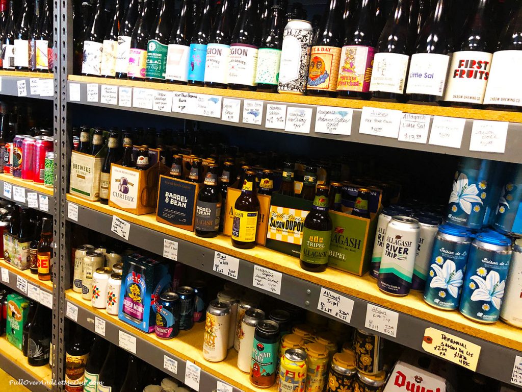Beer on shelves in the bottle shop at The Glass Jug Beer Lab in Durham, NC