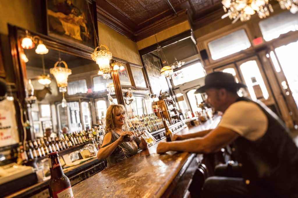 bar tender and patron at a bar in Virginia City, Nevada PullOverAndLetMeOut