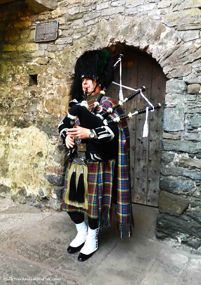 A bagpiper in front of Bunratty Castle