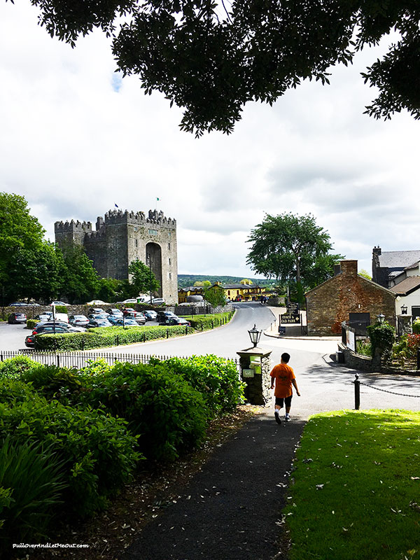 Boy walking to Bunratty Castle in Ireland