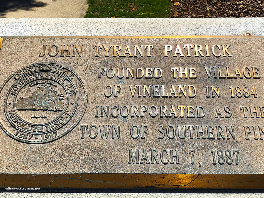 A brass plaque with the name John Tyrant Patrick