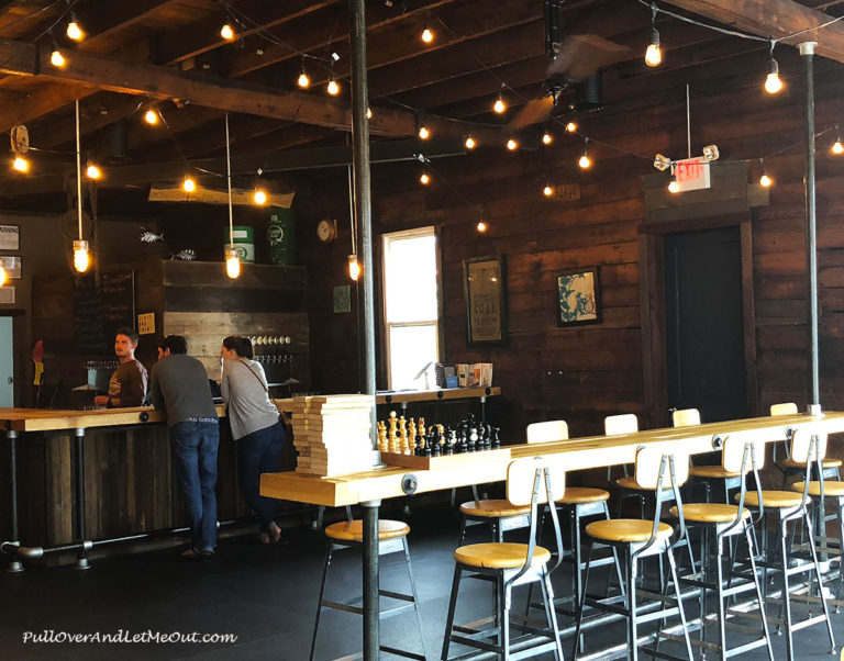 Customers ordering at the bar at Rooster Fish Pub in Watkins Glen, New York