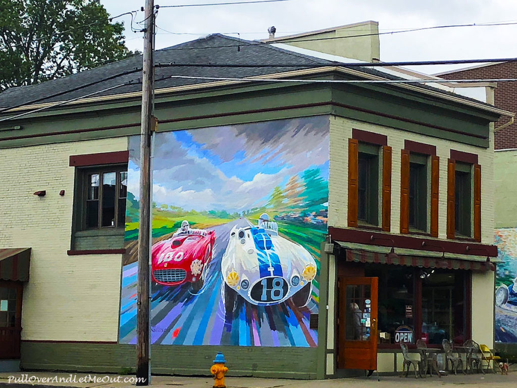 Street art of race cars on a building in Watkins Glen, NY