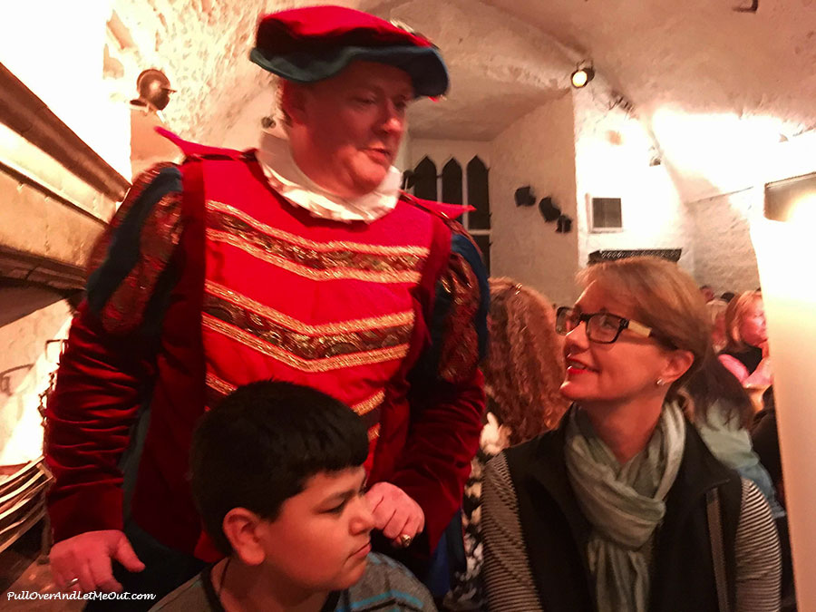 A man in Medieval costume speaking to diners at Bunratty Castle's Medieval Banquet