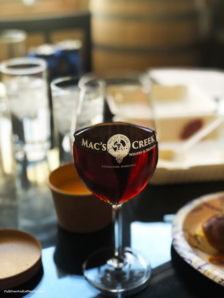 A glass of wine in a Mac's Creek wine glass