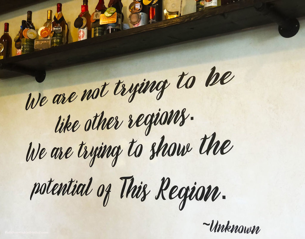 a wine quote on a wall