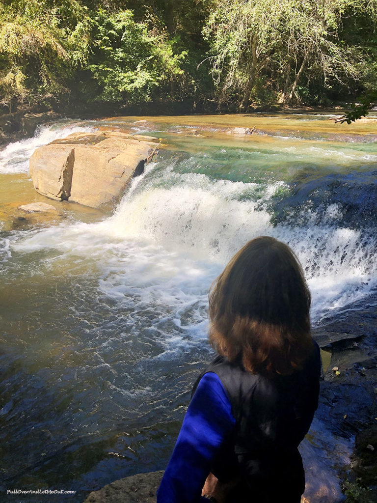 Woman looking at Carter Falls in Elkin, NC PullOverAndLetMeOut