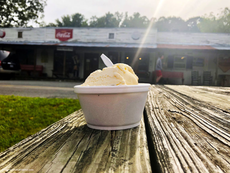 A sonker on a table with a scoop of ice cream