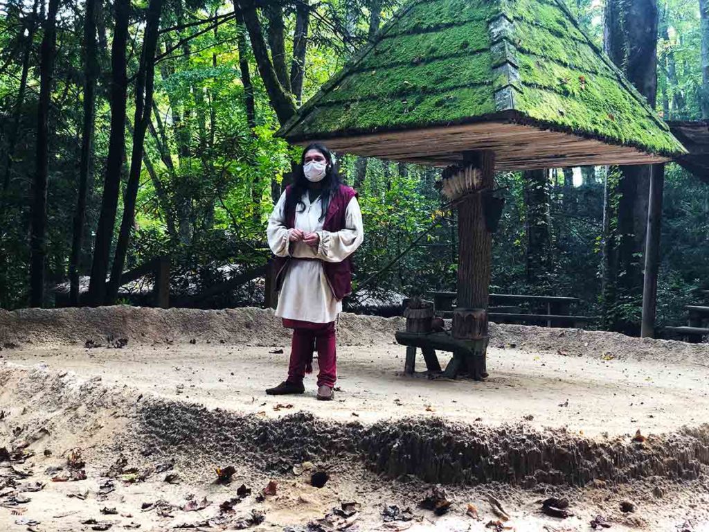 Native American interpreter at the square grounds in the Oconaluftee Indian Village