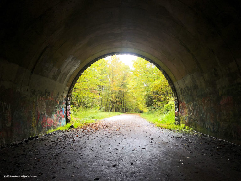 Inside a tunnel looking out at trees. Road to Nowhere Bryson City, NC PullOverAndLetMeOut