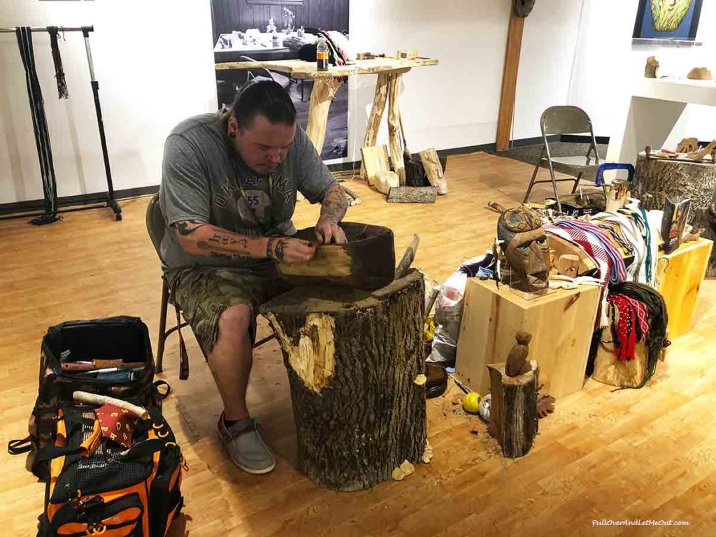 Cherokee craftsman carving wooden mask. PullOverAndLetMeOUt