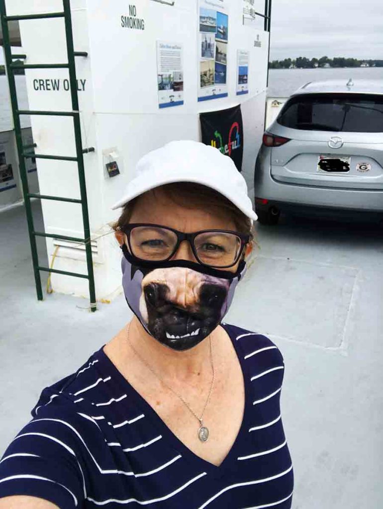 woman posing for a selfie on a ferry