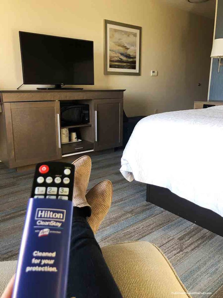 picture of a remote control in front of a tv in a hotel room