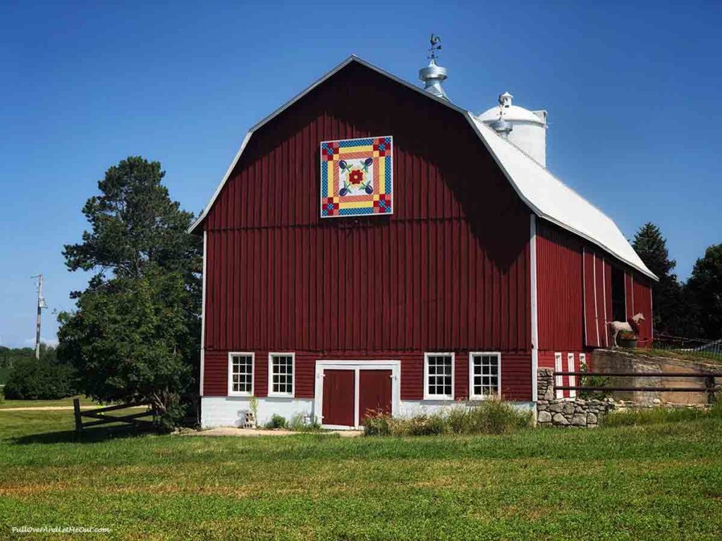 Red barn with a "quilt" design over the door. Door County Wisconsin PullOverAndLetMeOut