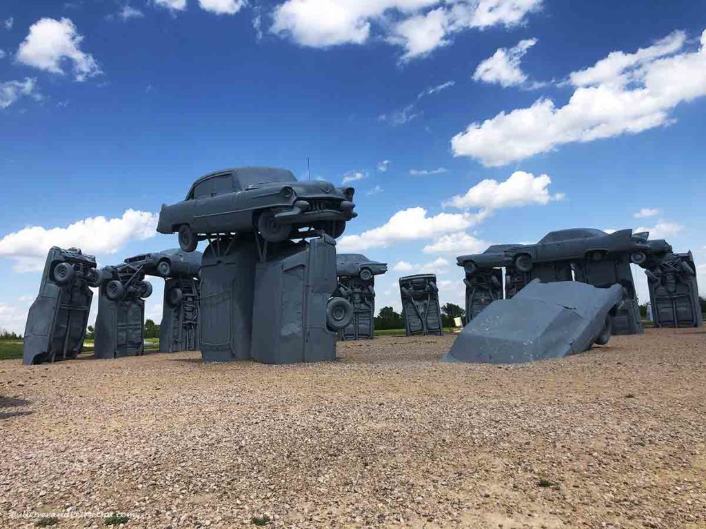 cars stacked to form stonehenge called carhenge