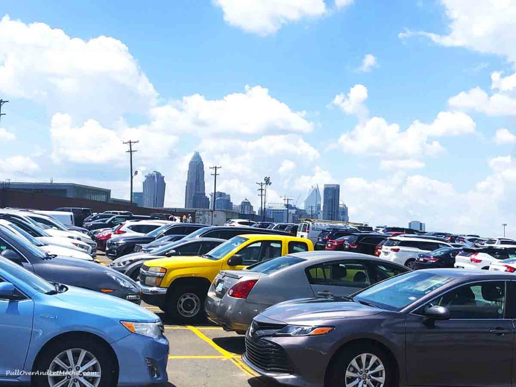 parking lot in shadow of downtown Charlotte, NC