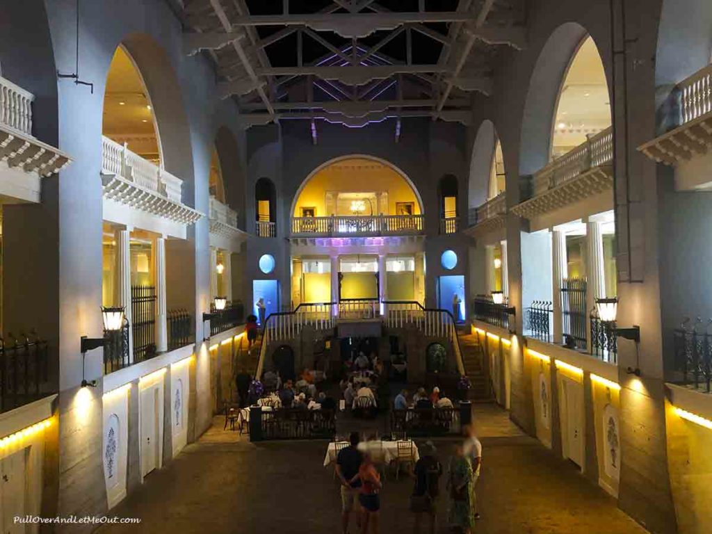 people waiting for a table at a restaurant in what was the world's largest indoor swimming pool