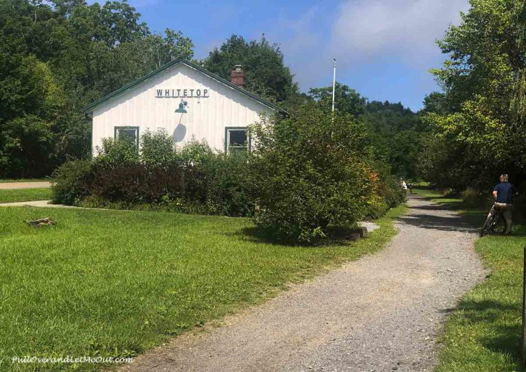 A white building with the words White Top in green