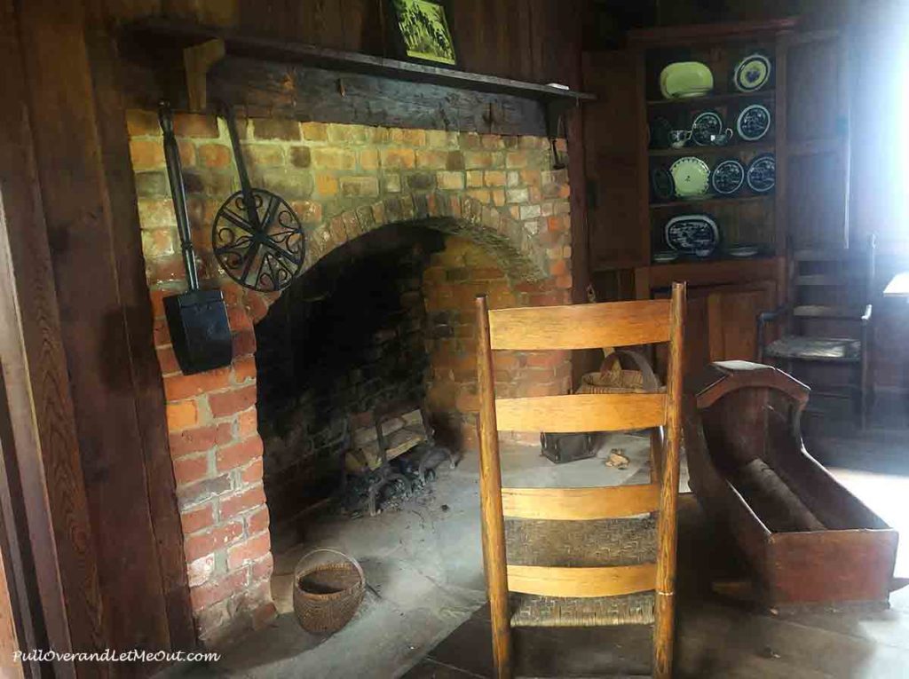 a fireplace in a log home