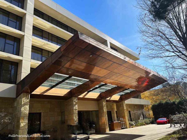 the copper awning on the front of a hotel