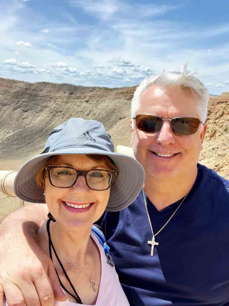 a woman and man at the Meteor Crater in Northern AZ