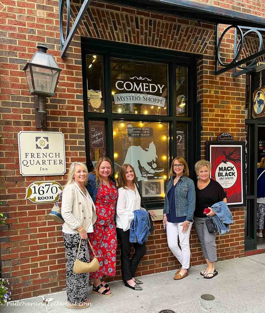 five women in front of the entrance to the Black Fedora Theater in Charleston, SC