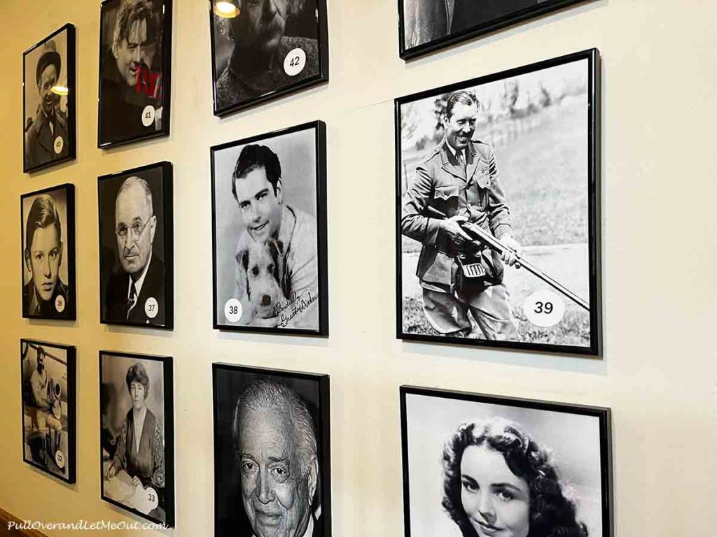 a wall of pictures of famous people