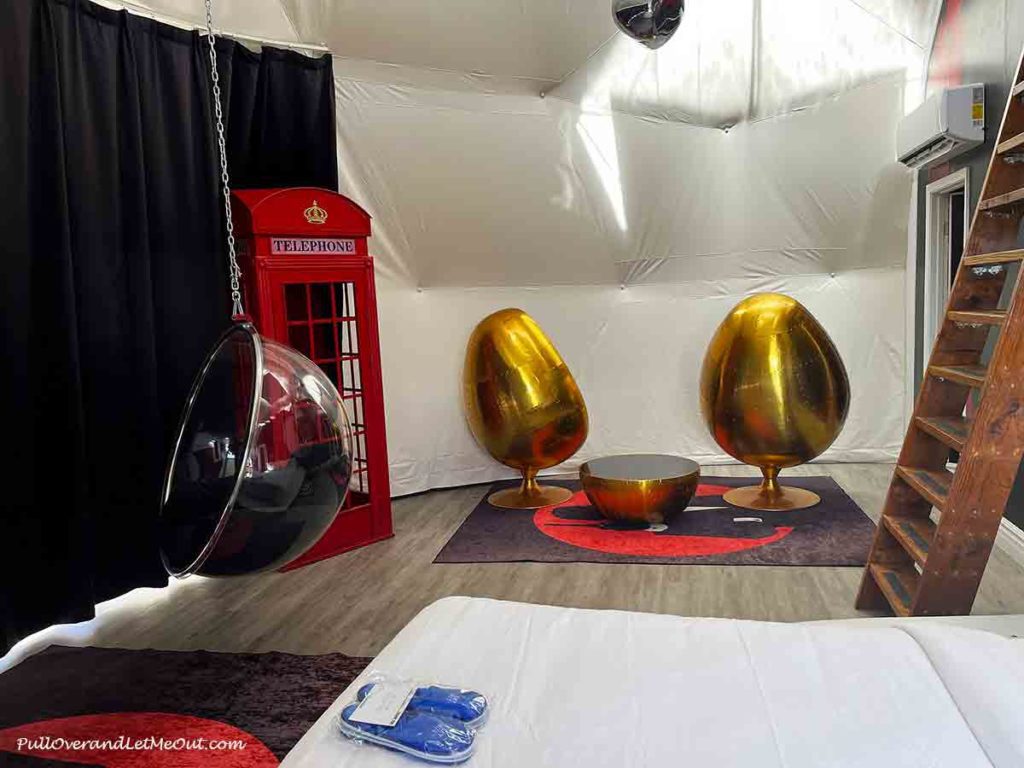 two gold egg chairs