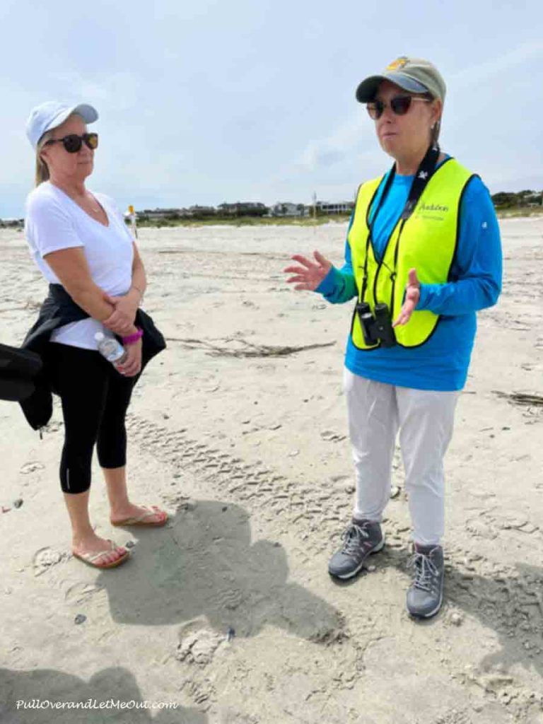 a rep from the Audubon Society explaing to another woman