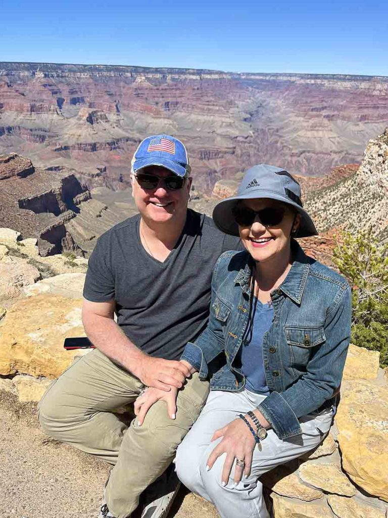 a man and a woman at the Grand Canyon