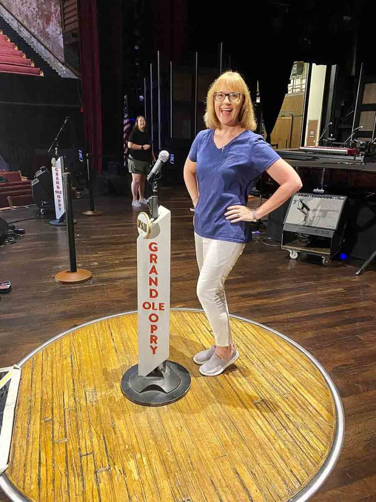 a woman on stage at the Grand Ole Opry