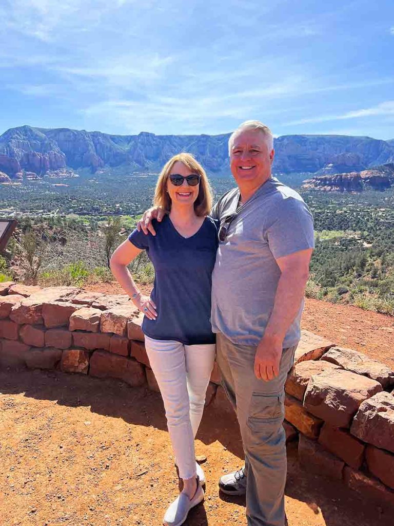 a woman and a man in front of Sedona Red Rocks