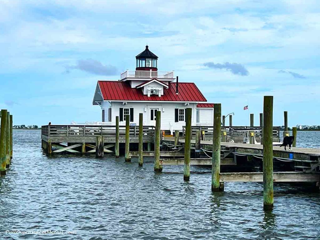 a light house at the end of a dock