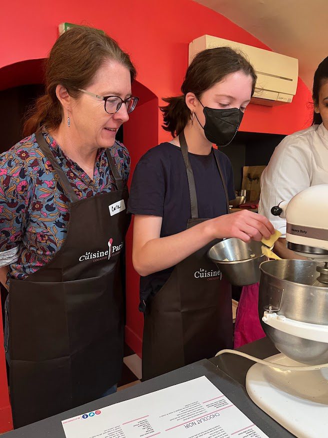 two women making macarons