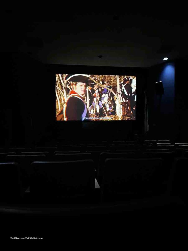 a movie screen with a Revolutionary War soldier on it.
