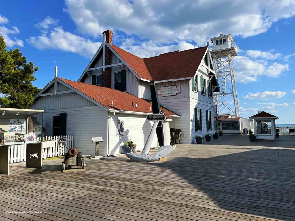 a museum at the beach by a boardwalk