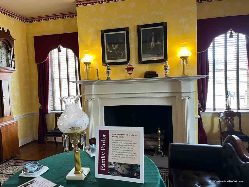 a picture of a fireplace in a family parlor