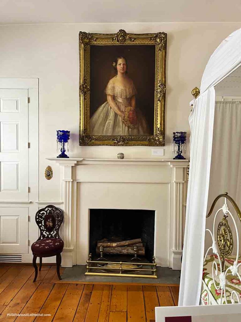 a portrait of a young Mary Todd Lincoln over a fireplace