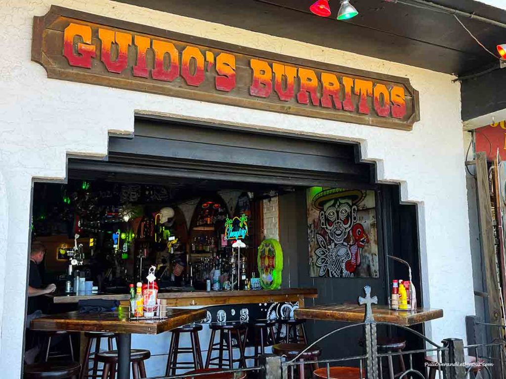 the front of a restaurant called Guido's Burritos